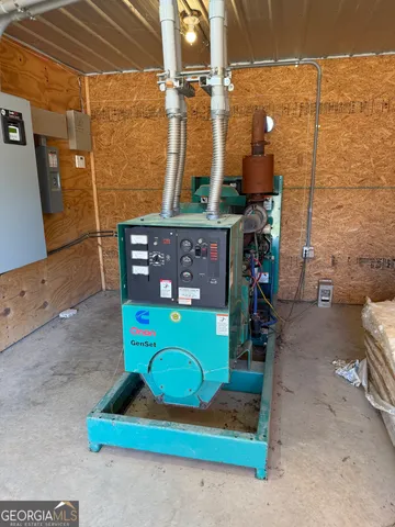 a bedroom with bed and a chandelier