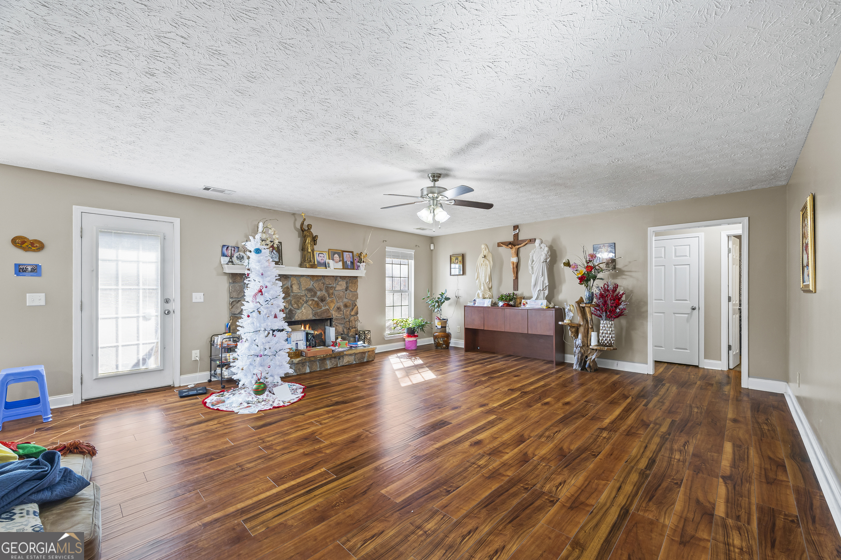 747 Washington Road Lexington, GA 30648 - Photo 111 of 118 a living room with furniture and a wooden floor