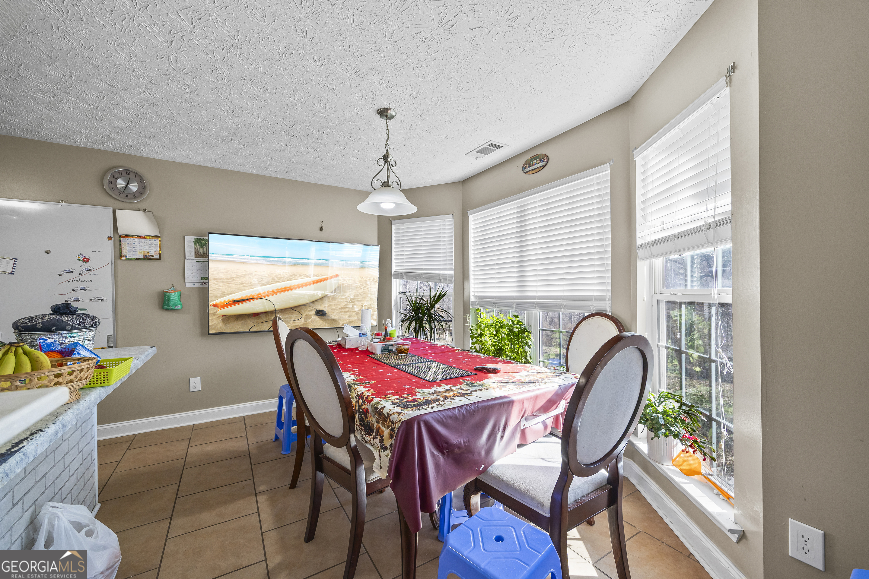 747 Washington Road Lexington, GA 30648 - Photo 112 of 118 a view of a dining room with furniture and chandelier