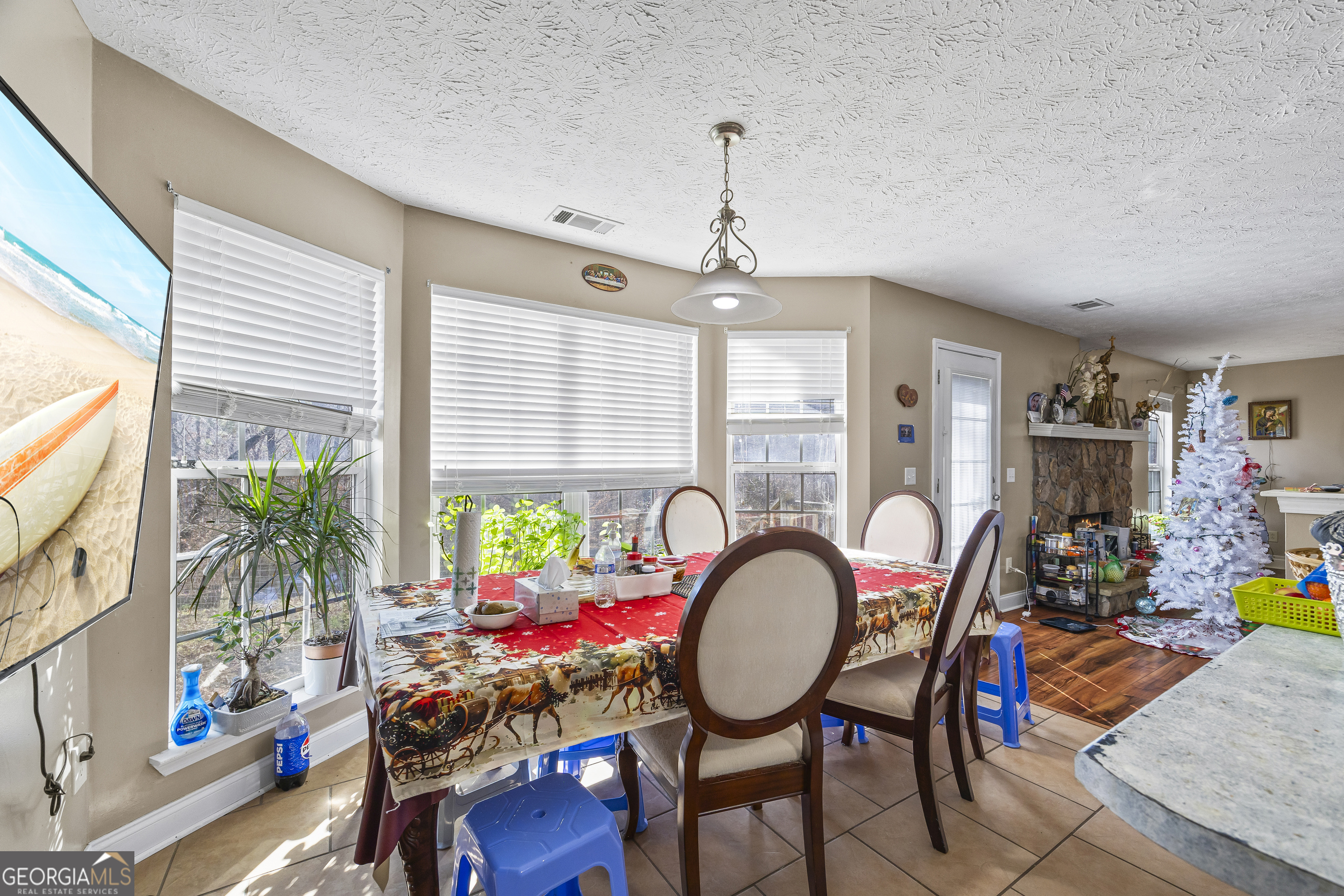 747 Washington Road Lexington, GA 30648 - Photo 113 of 118 a view of a dining room with furniture window and wooden floor