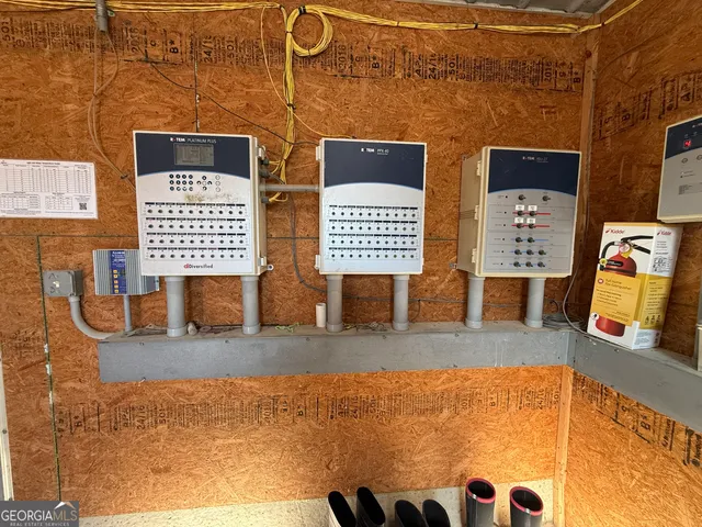 a utility room with dryer washer and a rug