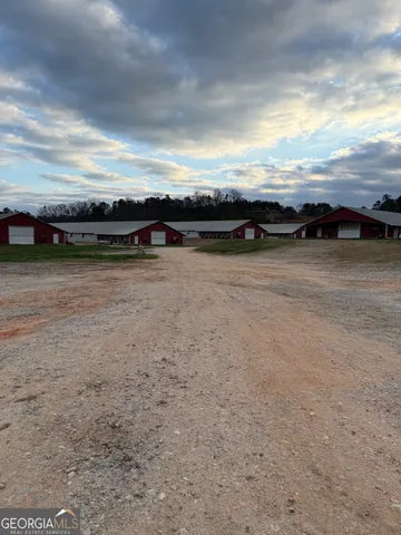 a view of a backyard of a house with a yard and lake view