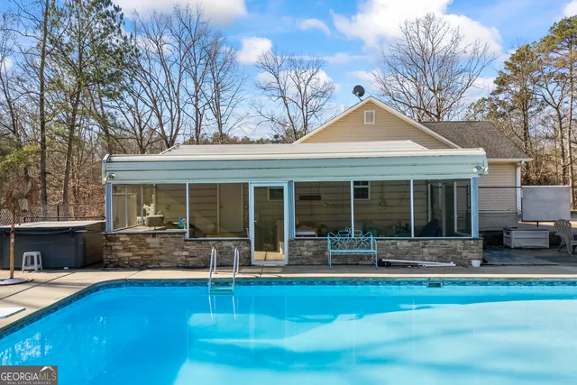 a view of a wooden bench in back yard
