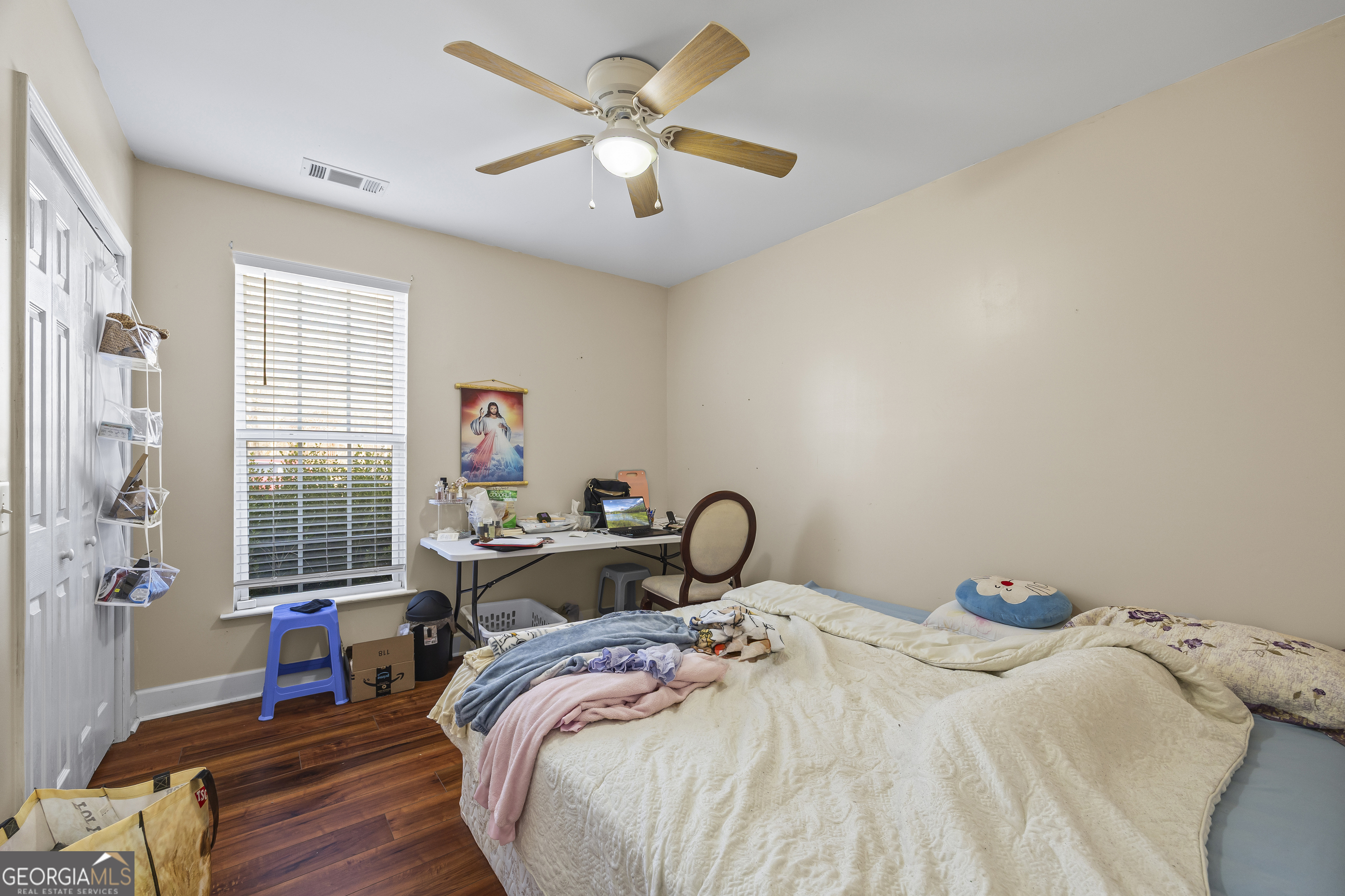 747 Washington Road Lexington, GA 30648 - Photo 35 of 118 a bedroom with bed and a chandelier
