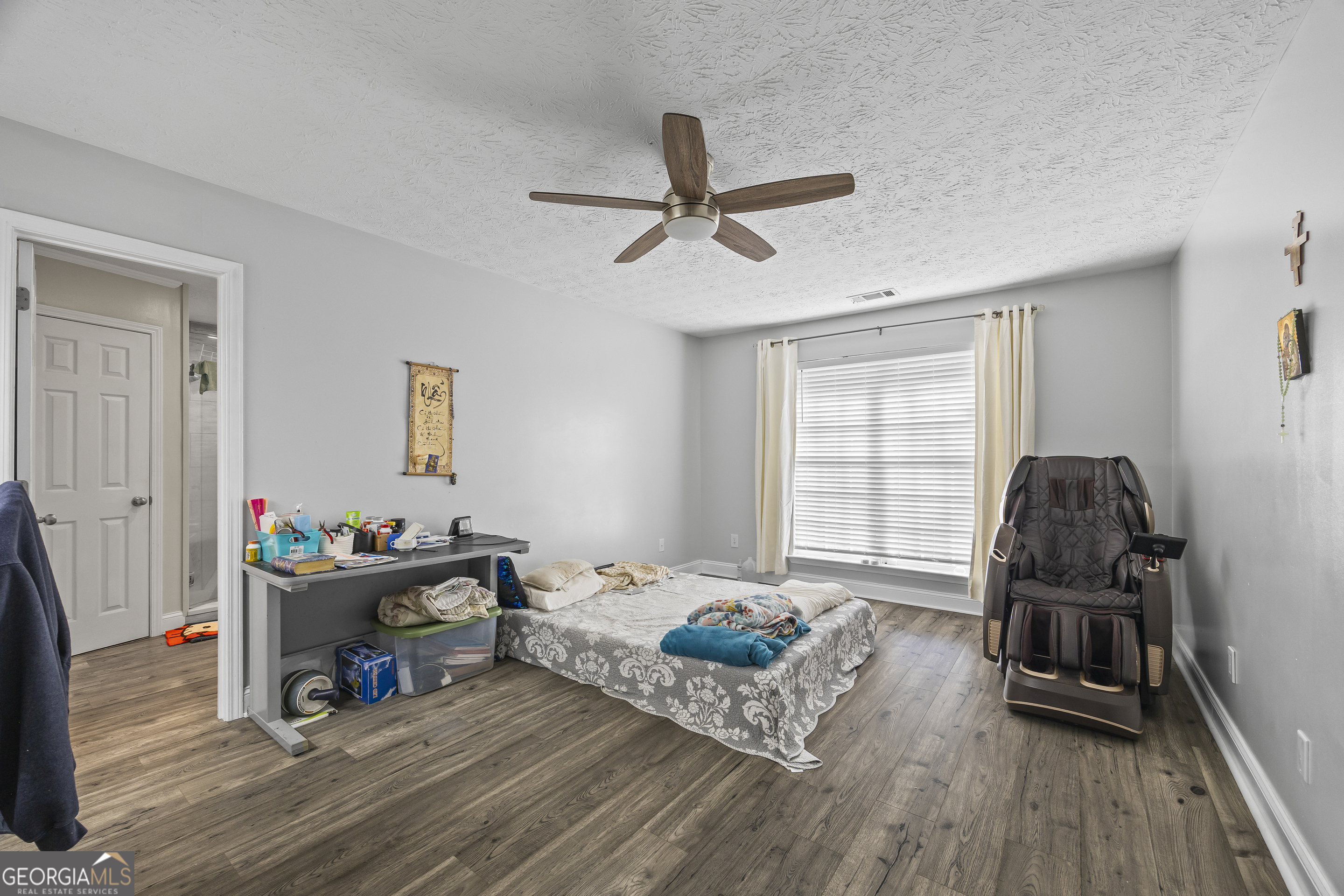 747 Washington Road Lexington, GA 30648 - Photo 45 of 118 a living room with furniture and a wooden floor