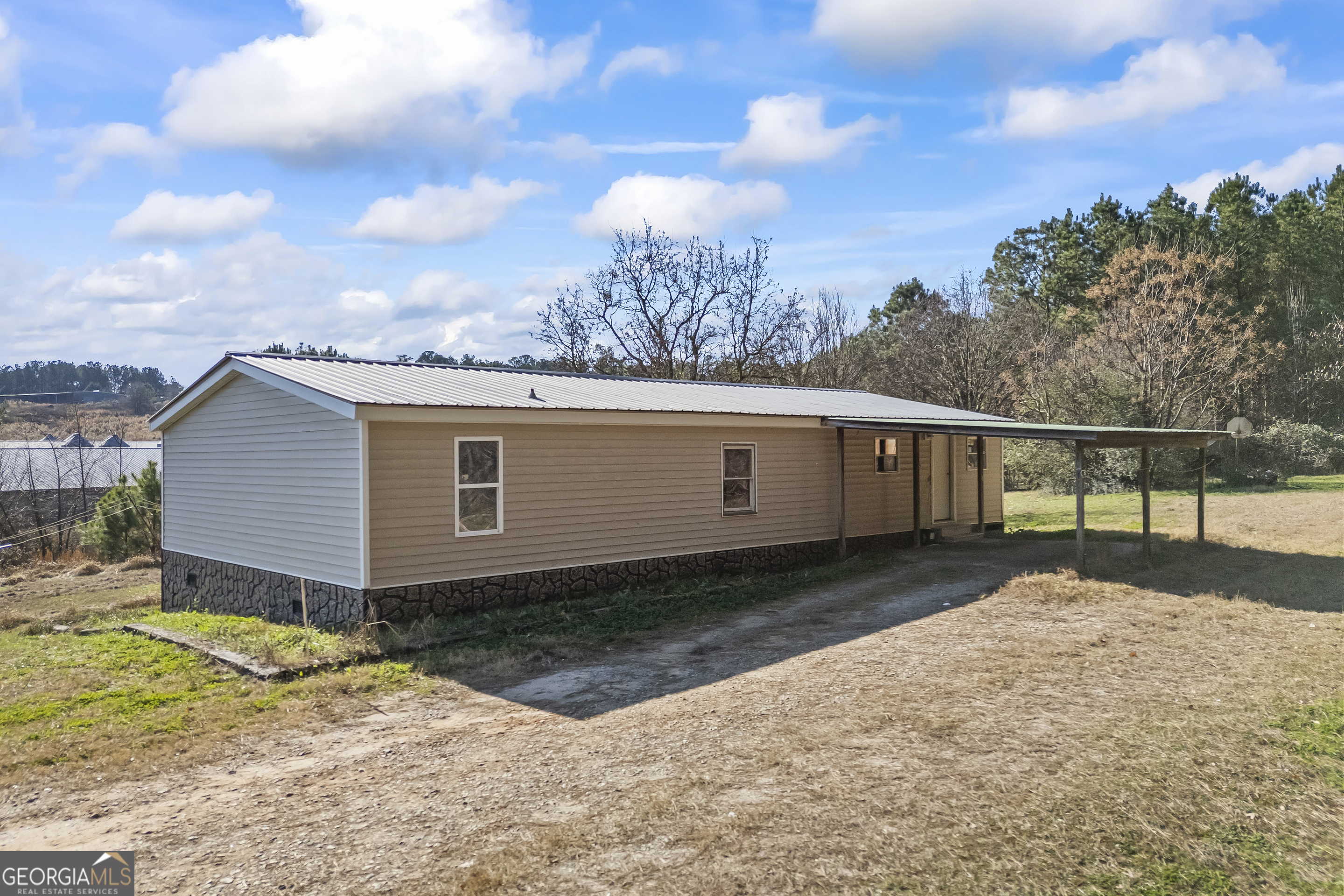747 Washington Road Lexington, GA 30648 - Photo 63 of 118 a view of a house with a yard