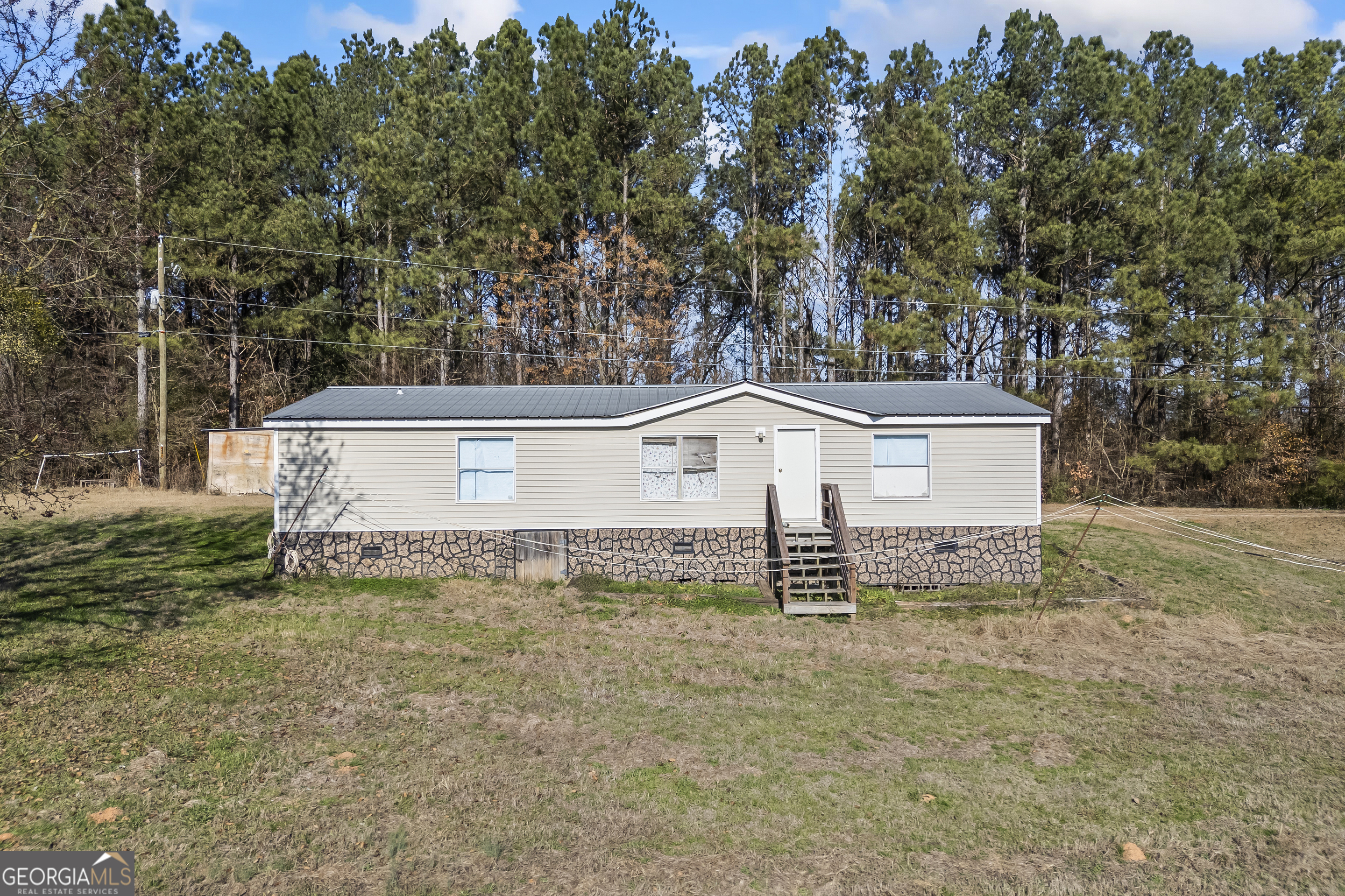 747 Washington Road Lexington, GA 30648 - Photo 65 of 118 a view of a house with a yard