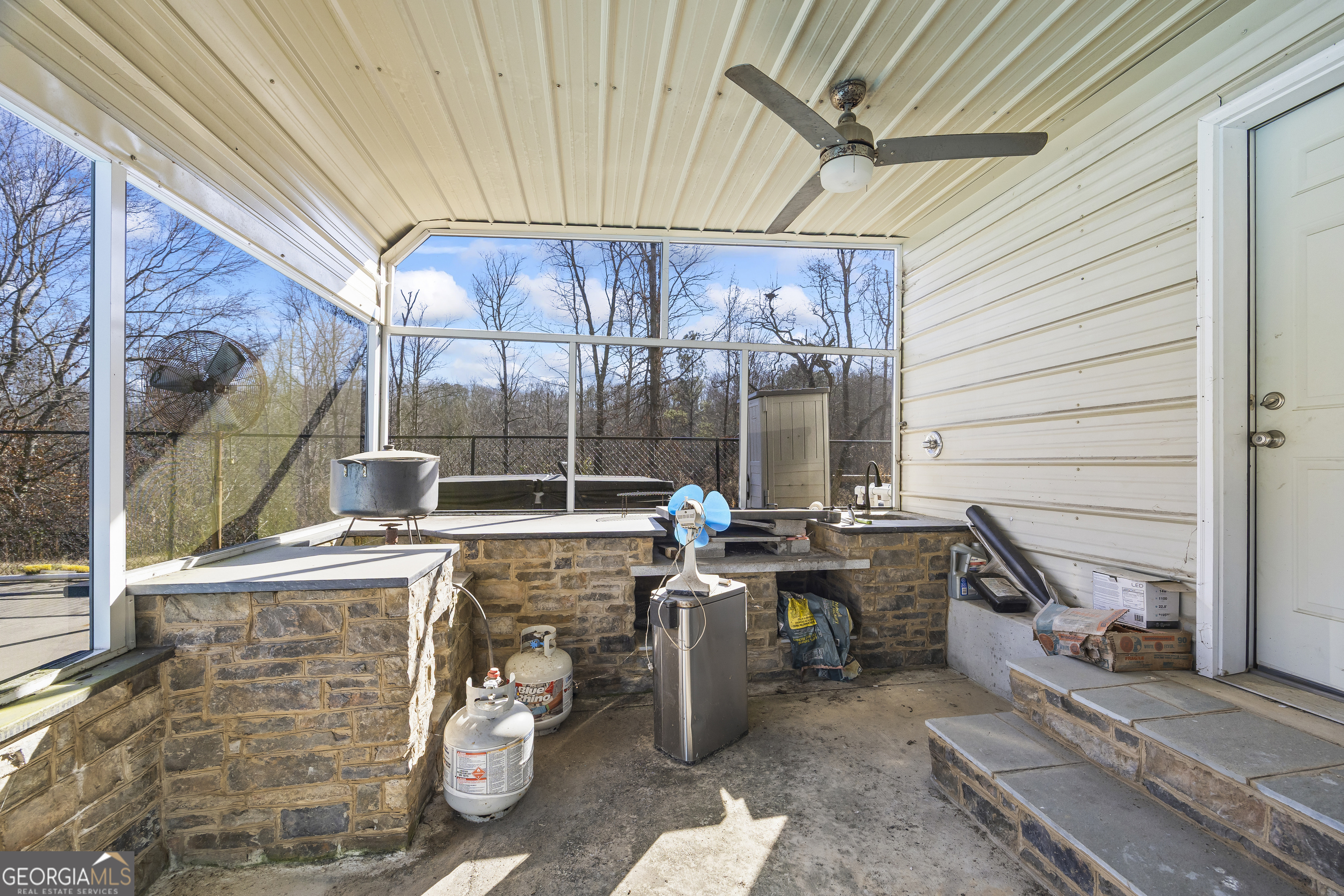 747 Washington Road Lexington, GA 30648 - Photo 97 of 118 a view of a patio with table and chairs and potted plants