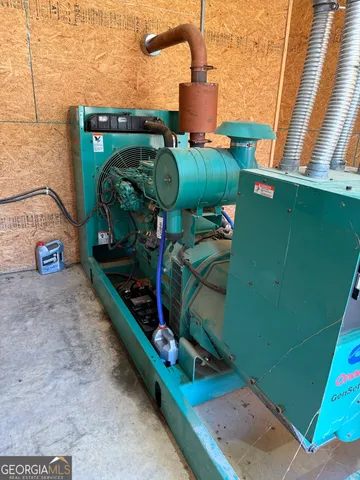 a bathroom with a granite countertop toilet sink and mirror