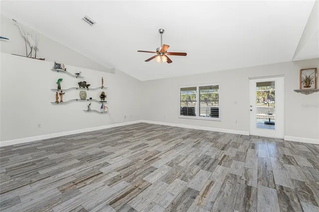 a dining room with furniture and wooden floor