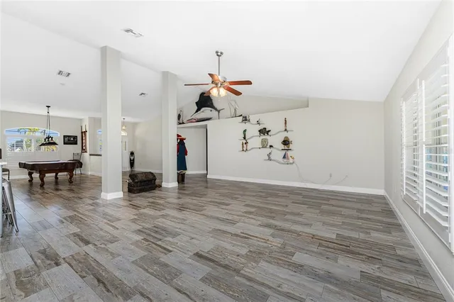 a kitchen with stainless steel appliances granite countertop a stove top oven a sink dishwasher a refrigerator and a microwave