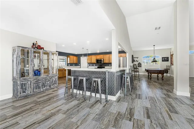 a kitchen with a stove a sink and a refrigerator