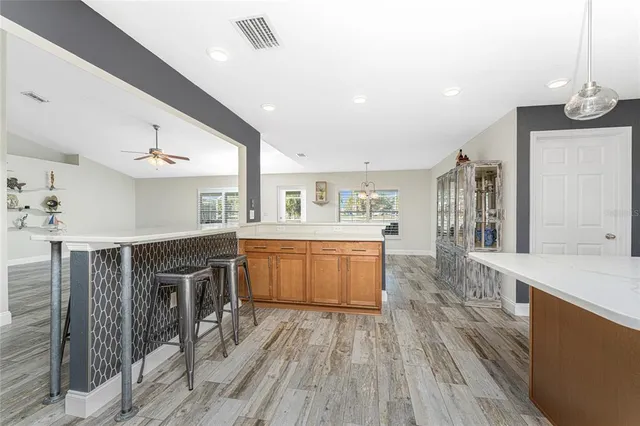 a white toilet sitting next to a bath tub