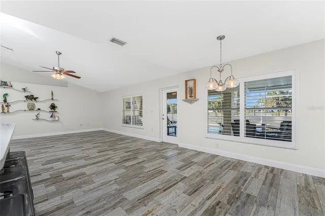 a bedroom with a bed and a table in it