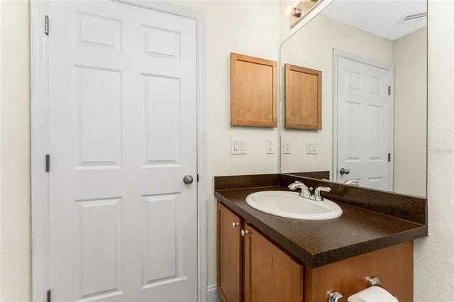 a view of a dining room and livingroom with furniture wooden floor and a rug