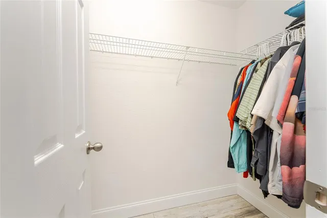 a view of a house with swimming pool and a yard