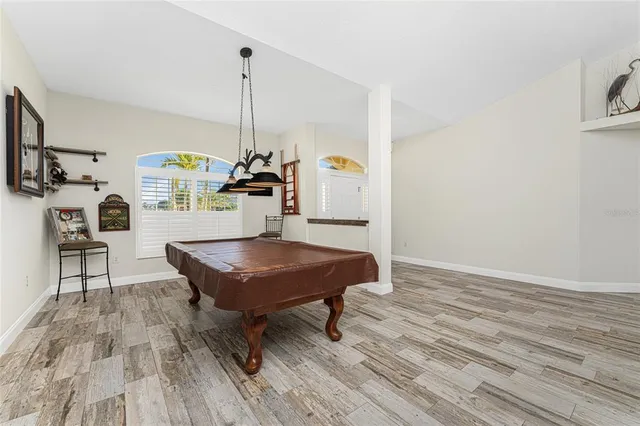 a view of a room with wooden floor