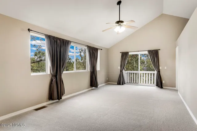 a view of a room with a large bed and a large window