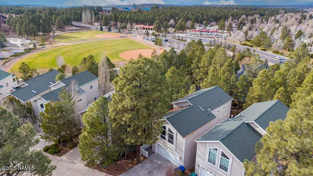 an aerial view of residential house with outdoor space and swimming pool