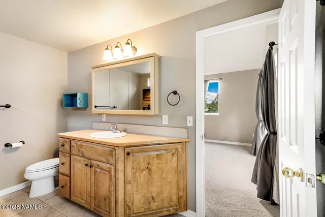 a bathroom with a shower and a sink