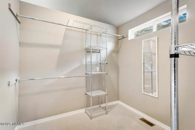 a bathroom with a shower and a glass door