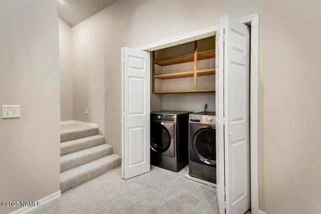 a view of a room with a washer and dryer