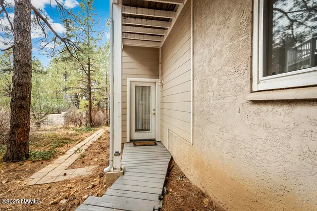 a view of a livingroom with a large window and couch
