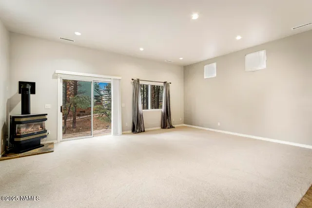 a kitchen with a stove cabinets and a refrigerator