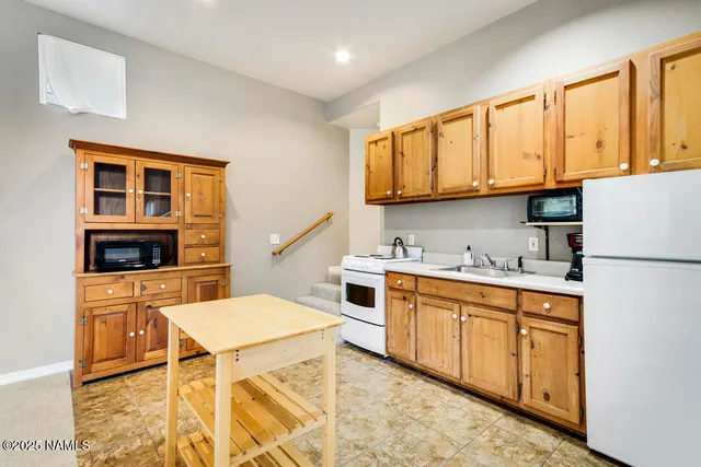 a bathroom with a toilet a sink and a mirror