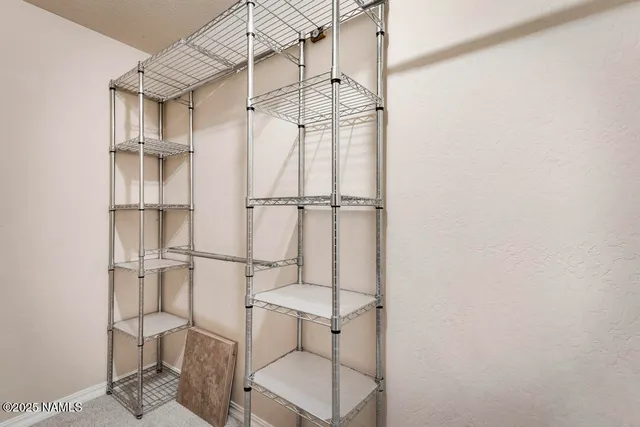 a view of a wooden balcony and trees