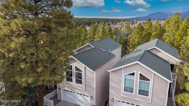 a view of a balcony with wooden floor and fence