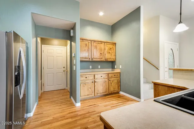 a spacious bathroom with a granite countertop sink and a mirror