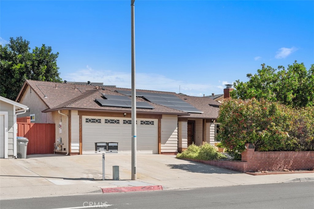 Inviting front exterior with clean lines, refreshed landscaping, and a welcoming approach that gives the home strong curb appeal. The single-story design offers an easy, approachable feel from the moment you arrive.