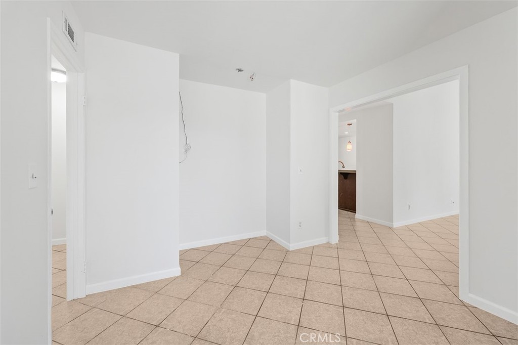 10424 2nd Street Santee, CA 92071 - Photo 12 of 28 Additional angle of the dining area shows the open configuration and easy connection to the rest of the home. The neutral finishes keep the space feeling fresh and versatile.