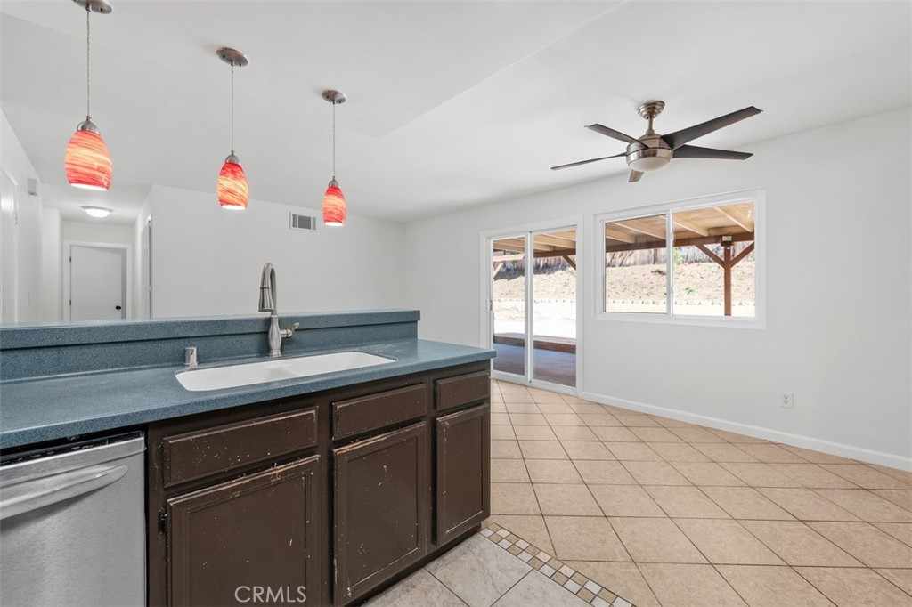 10424 2nd Street Santee, CA 92071 - Photo 18 of 28 Breakfast bar and adjacent dining area create an easy flow for casual meals and conversation. Pendant lighting adds a warm touch and helps define the space.