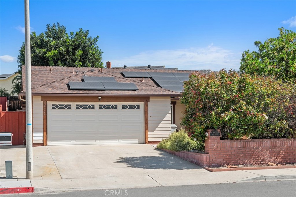 10424 2nd Street Santee, CA 92071 - Photo 2 of 28 The front elevation highlights the attached two-car garage and low-maintenance yard, creating a practical and polished first impression. Mature greenery adds warmth and character to the exterior.