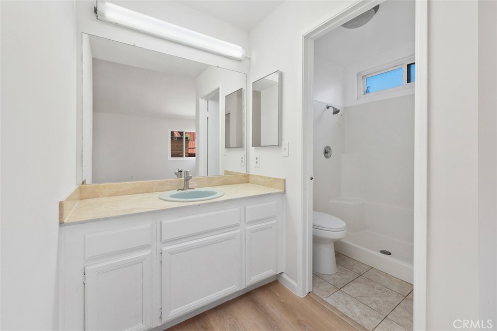 10424 2nd Street Santee, CA 92071 - Photo 21 of 28 Vanity area offers useful storage and a bright, practical setup for daily routines. The clean design keeps the space feeling fresh and functional.