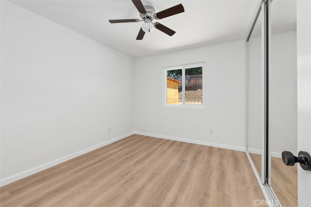 10424 2nd Street Santee, CA 92071 - Photo 22 of 28 Bedroom with ceiling fan and updated flooring provides a calm, comfortable retreat. Its clean lines and neutral palette create an easy, relaxed atmosphere.