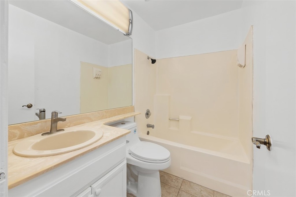 10424 2nd Street Santee, CA 92071 - Photo 23 of 28 Full bathroom includes a large vanity and tub-shower combination, offering both convenience and everyday functionality. The layout is spacious and easy to use.