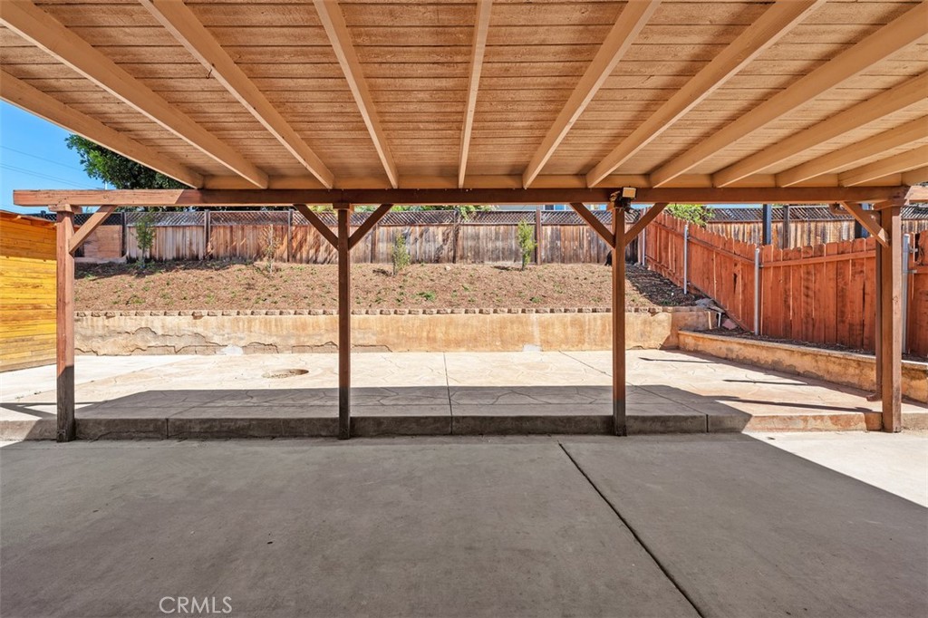 10424 2nd Street Santee, CA 92071 - Photo 24 of 28 Covered patio creates a generous outdoor living space with plenty of room for dining, relaxing, or weekend gatherings. The overhead cover adds shade and year-round usability.