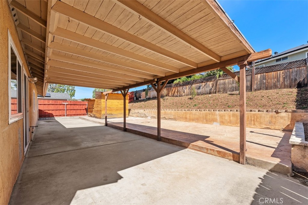 10424 2nd Street Santee, CA 92071 - Photo 25 of 28 Another view beneath the covered patio highlights the depth of the space and its flexibility for entertaining. This area extends the home’s living potential outdoors.