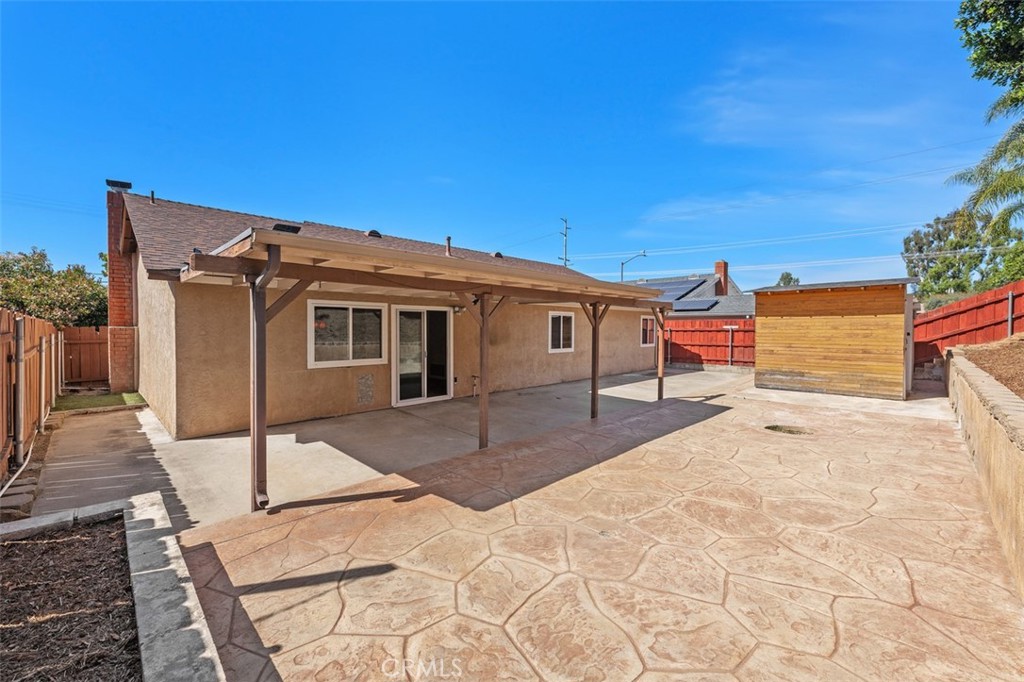 10424 2nd Street Santee, CA 92071 - Photo 26 of 28 Backyard offers a wide, usable outdoor area with patio space and room to customize for gardening, play, or additional seating. The low-maintenance setup supports easy enjoyment.