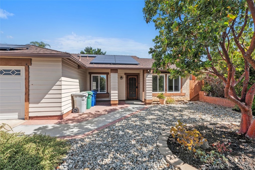 10424 2nd Street Santee, CA 92071 - Photo 6 of 28 Gated front courtyard adds charm and a sense of separation from the street, offering a pleasant space to greet guests or enjoy a quiet moment outdoors. The entry sequence feels both inviting and secure.