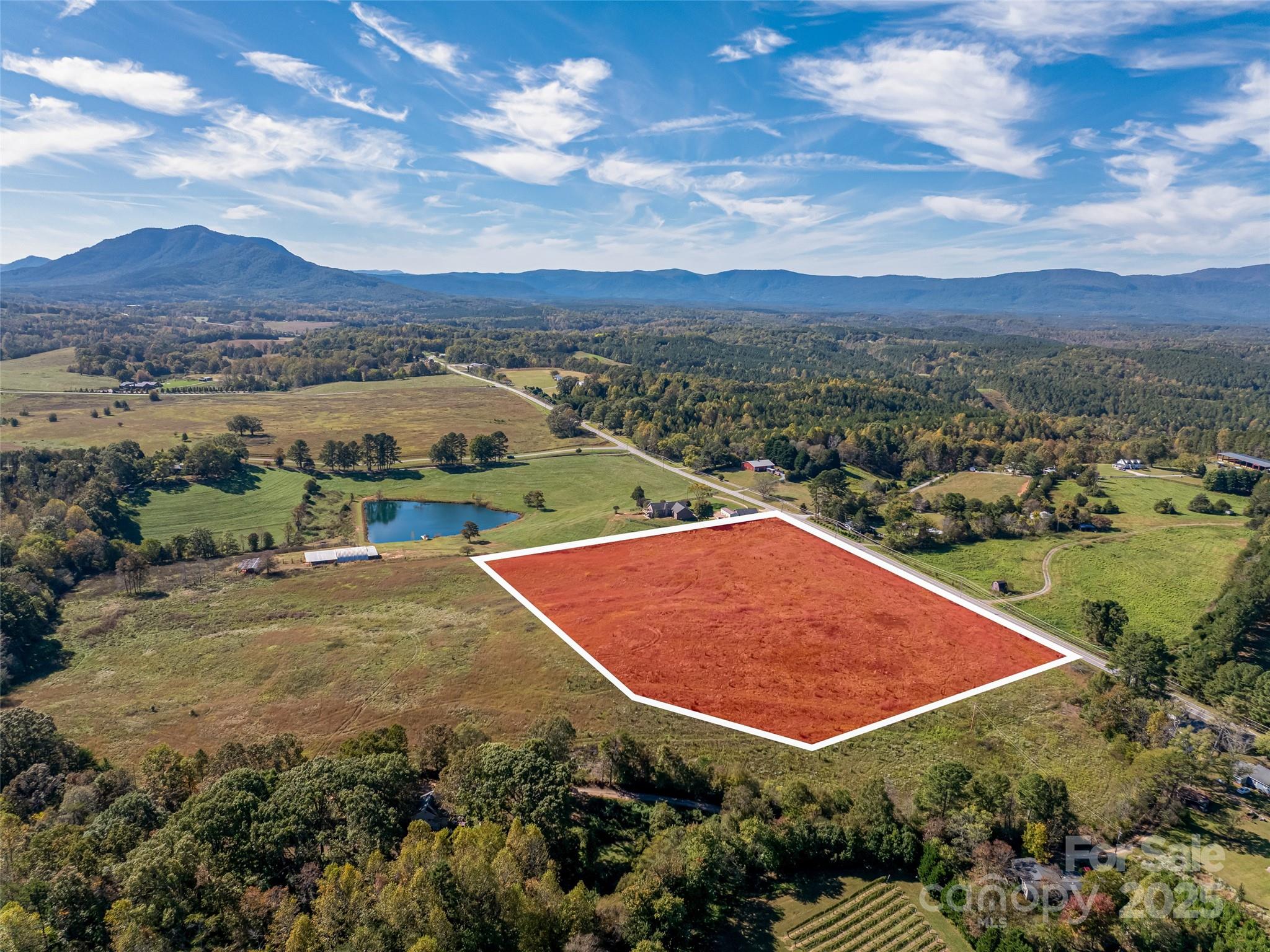 an aerial view of residential houses and outdoor space