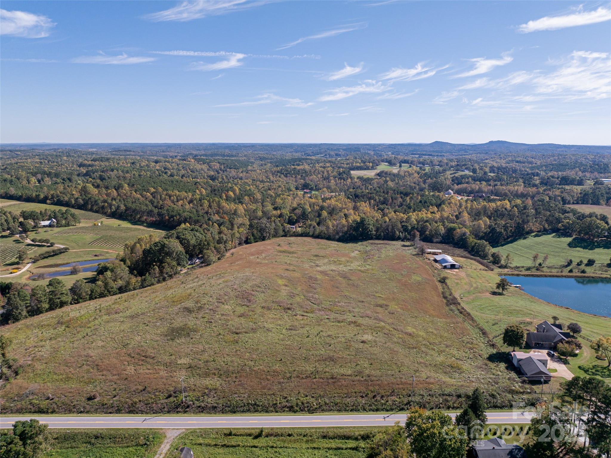 0 East Nc Highway, Unit LOT 55 Mill Spring, NC 28756 - Photo 17 of 17 a view of a dry yard with wooden fence