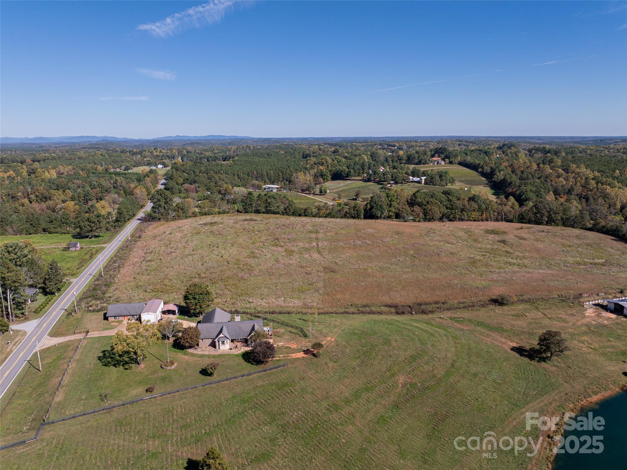0 East Nc Highway, Unit LOT 55 Mill Spring, NC 28756 - Photo 3 of 17 an aerial view of a house with a yard