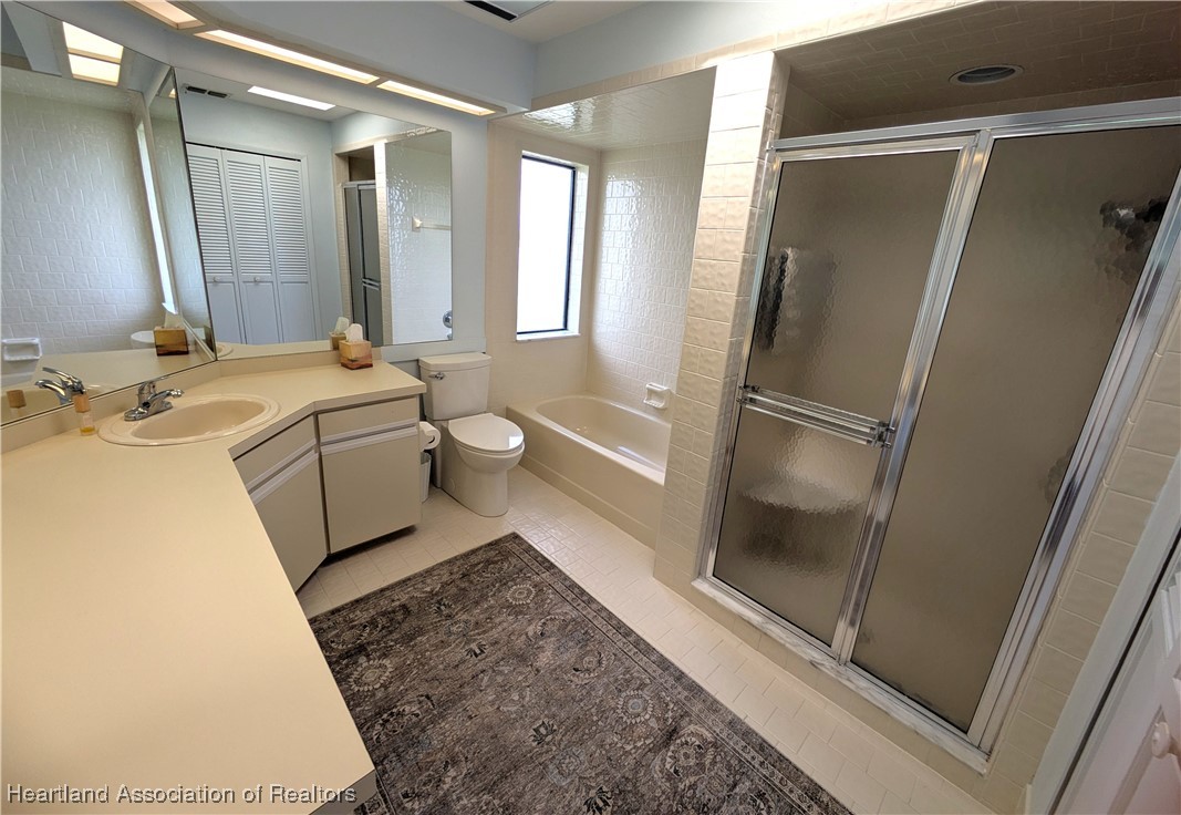 2708 Par Road Sebring, FL 33872 - Photo 16 of 33 a bathroom with a sink toilet and shower