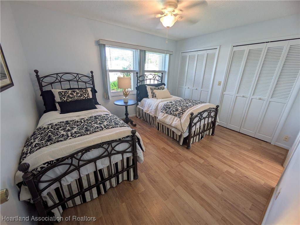 2708 Par Road Sebring, FL 33872 - Photo 19 of 33 a bedroom with two beds and a table