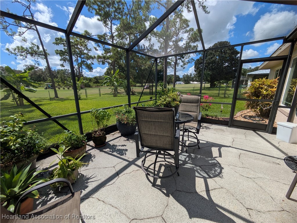 2708 Par Road Sebring, FL 33872 - Photo 24 of 33 a view of a chairs and table in backyard