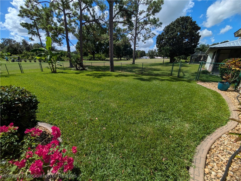 2708 Par Road Sebring, FL 33872 - Photo 25 of 33 a view of a park with lots of flowers and trees